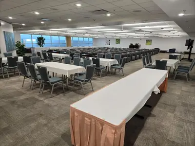 a conference room with white tables and chairs at Miami International Airport Hotel in Miami