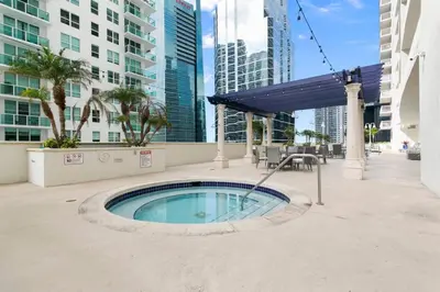 a swimming pool in the middle of a city with tall buildings at Centric Modern, Stylish Brickell / Miami + FREE Parking in Miami