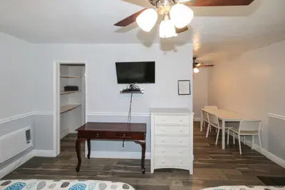 a study room with a desk and a table at The Dolphin Hollywood in Hollywood