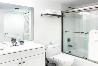 a white bathroom with a shower and a toilet at Top Stay Miami Platinum Brickell in Miami