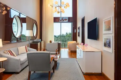 a living room with a couch and a table at Mr. C Miami - Coconut Grove in Miami