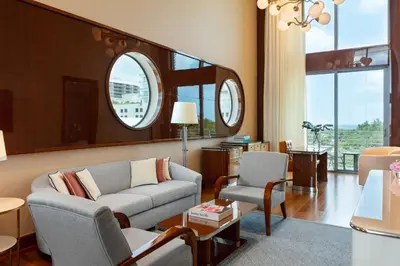 a living room with a couch and two chairs at Mr. C Miami - Coconut Grove in Miami