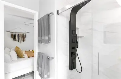 a shower with a glass door in a bathroom at Pool House 3B-2B King Bed - BBQ - EV in Hollywood