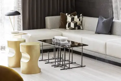 a living room with a couch and a coffee table at AC Hotel by Marriott Miami Airport West/Doral in Miami