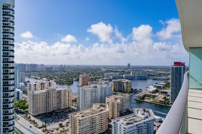 an aerial view of a city with a river and buildings at Private Ocean Condos at Hyde Beach Resort & Residences in Hollywood