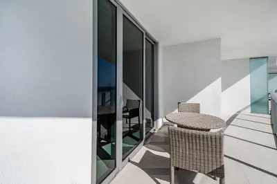 a room with a balcony with a table and chairs at Private Ocean Condos at Hyde Beach Resort & Residences in Hollywood