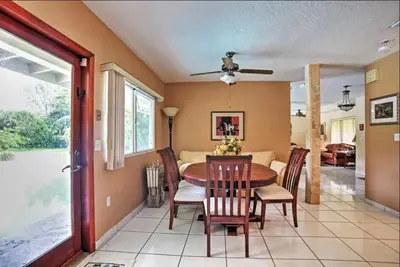 a dining room with a table and chairs at 7545 Southwest 124th Street in Miami