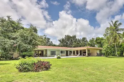 a house with a green lawn in front of it at 7545 Southwest 124th Street in Miami
