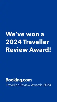 a blue sign that says weve won a traveler review award at 7545 Southwest 124th Street in Miami