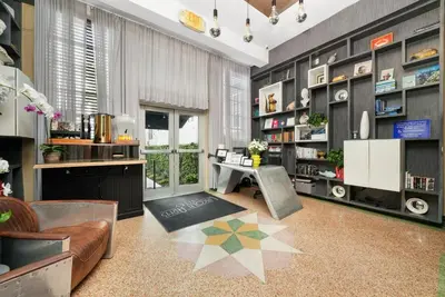 a living room with a couch and a table at Lincoln Arms Suites in Miami Beach