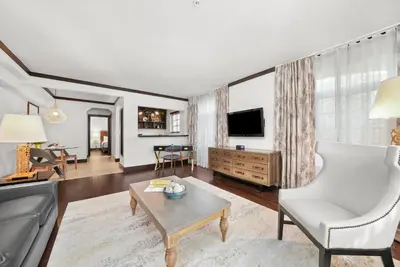 a living room with a couch and a table at Lincoln Arms Suites in Miami Beach