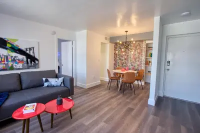 a living room with a couch and a table at 23 Palms Suites - Midtown Wynwood in Miami