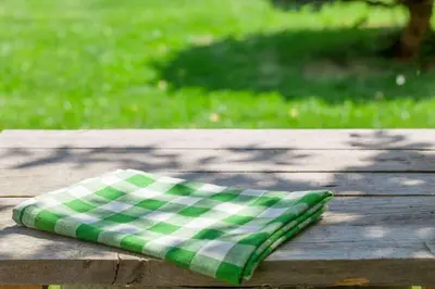 a green and white pillow sitting on a wooden table at Extended Stay America Premier Suites - Miami - Downtown Brickell - Cruise Port in Miami