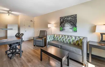 a living room with a couch and a desk at Extended Stay America Premier Suites - Miami - Airport - Doral - 25th Street in Miami