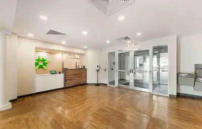 an empty room with a hardwood floor in a building at Extended Stay America Premier Suites - Miami - Airport - Doral - 25th Street in Miami