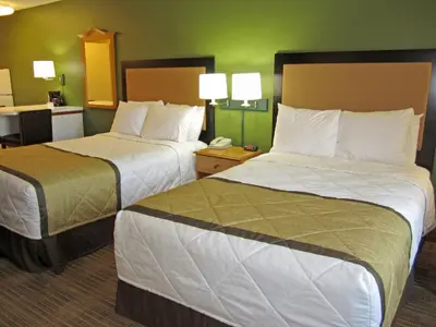 two beds in a hotel room with two at Extended Stay America Suites - Fort Lauderdale - Davie in Davie