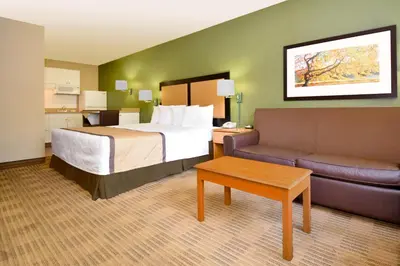 a hotel room with a bed and a couch at Extended Stay America Suites - Fort Lauderdale - Davie in Davie