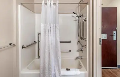 a bathroom with a shower curtain and a tub at Extended Stay America Suites - Fort Lauderdale - Plantation in Plantation