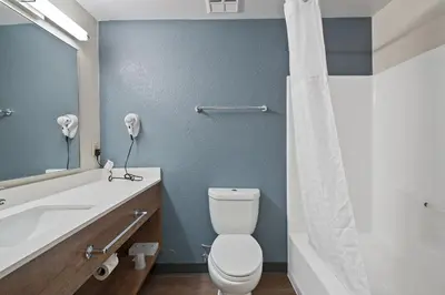a bathroom with a toilet and a sink at Extended Stay America Suites - Fort Lauderdale - Plantation in Plantation
