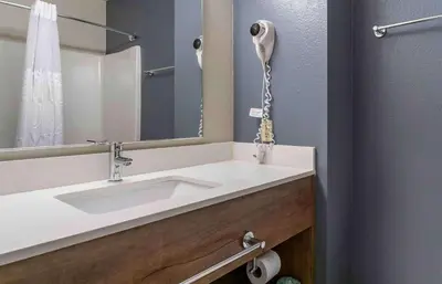 a bathroom with a sink and a mirror at Extended Stay America Premier Suites - Miami - Coral Gables in Miami