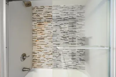 a bathroom with a shower with a brick wall at Great 2 Bedrooms in Brickell in Miami