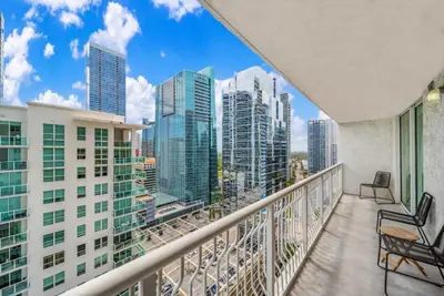 a balcony with chairs and a view of the city at Great 2 Bedrooms in Brickell in Miami