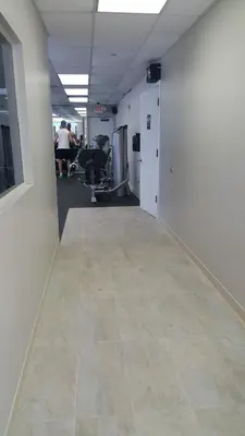 a hallway of an office with a tile floor at Miami Direct Access to the beach in Miami Beach