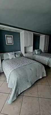 a bedroom with two twin beds in it at Miami Direct Access to the beach in Miami Beach