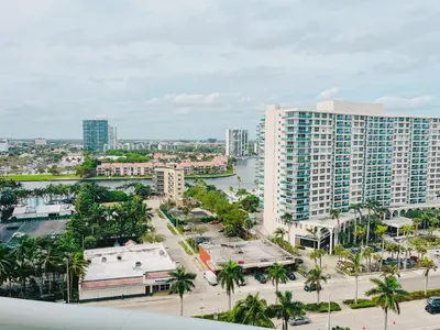 an aerial view of a city with a large building at Hallandale Condo, Partial Ocean View Direct Beach and Pool Access Hollywood Beach in Hollywood