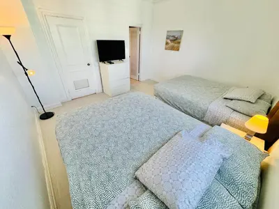 a small bedroom with two beds and a television at Miami Hollywood Incredible 2 Bedroom 2 Bathroom 005-22bmar in Hollywood