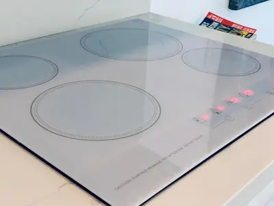 a display case with six circles on a table at Luxury white loft on Ocean Drive-South beach with a view in Miami Beach