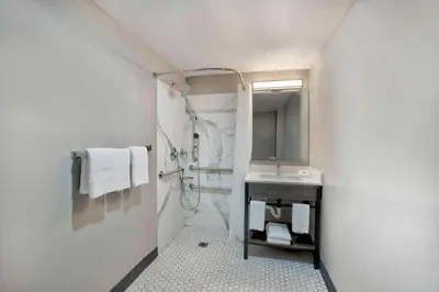 a bathroom with a sink and a mirror at Motel 6-Fort Lauderdale, FL in Fort Lauderdale