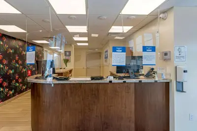 a lobby of a hospital with a reception counter at Downtown Hollywood Gardens Inn & Suites in Hollywood