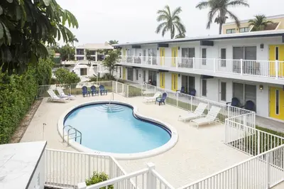 an image of a swimming pool in front of a building at Spectacular view on the canal, Fort Lauderdale, very clean, free Parking & Wifi in Fort Lauderdale