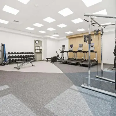 a room with a gym with treadmills and machines at Hilton Garden Inn Ft. Lauderdale Airport-Cruise Port in Dania Beach