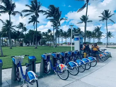 a row of bikes parked next to parking meters at Beach House BEACHFRONT STUDIO 107 in Miami Beach