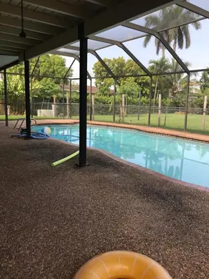 a swimming pool with a frisbee on the ground at 82-10SW 135AV in Miami