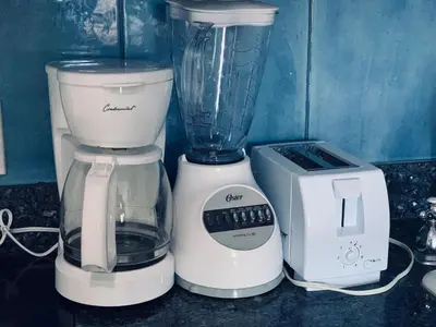 a blender and a toaster sitting on a counter at Beachfront Ocean Dr white sand paradise SoBe 311 in Miami Beach