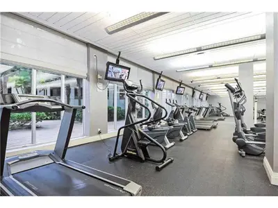 a gym with a row of treadms and cardio machines at Miami Hollywood Premier two bedroom with bay view 002-22bvic in Hollywood