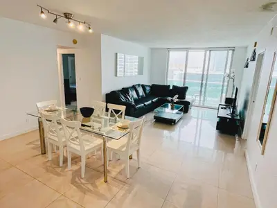 a living room with a glass table and a couch at Miami Hollywood Awesome 2 Bedroom 2 Bathroom 003-22bvic in Hollywood