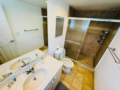 a bathroom with a sink and a shower and a toilet at Miami Hollywood High Rise Condo 004-22bvic in Hollywood