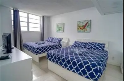 a bedroom with two beds and a television in it at Miami Hollywood 2 Bedroom on the Beach 007-21mar in Hollywood