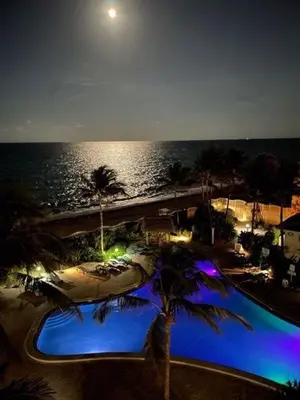 a view of a swimming pool at the beach at night at Miami Hollywood 2 Bedroom on the Beach 007-21mar in Hollywood