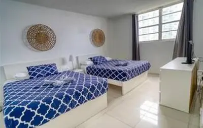 a bedroom with two beds and a window at Miami Hollywood 2 Bedroom on the Beach 007-21mar in Hollywood