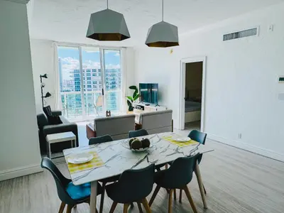 a dining room and living room with a table and chairs at Miami Hollywood Great Two Bedroom Apartment with Channel View 006-22bvic in Hollywood