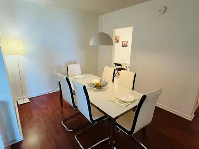 a dining room with a white table and chairs at Hollywood 2 Bedroom with Ocean View 004-21mar in Hollywood