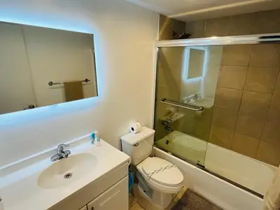 a bathroom with a toilet and a sink and a shower at Hollywood 2 Bedroom with Ocean View 004-21mar in Hollywood