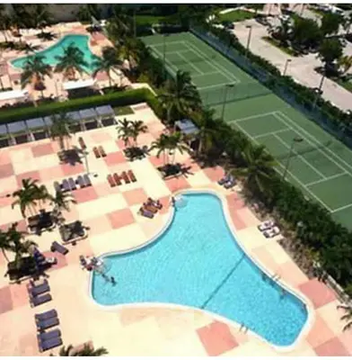 an overhead view of a tennis court and a pool at Miami Sunny Isles ocean reserve 704 in Miami