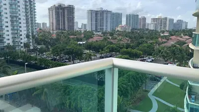 a balcony with a view of a city at Miami Sunny Isles ocean reserve 704 in Miami