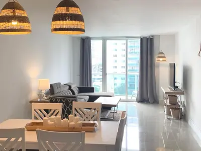 a living room with a couch and a table at Miami Sunny Isles ocean reserve 704 in Miami